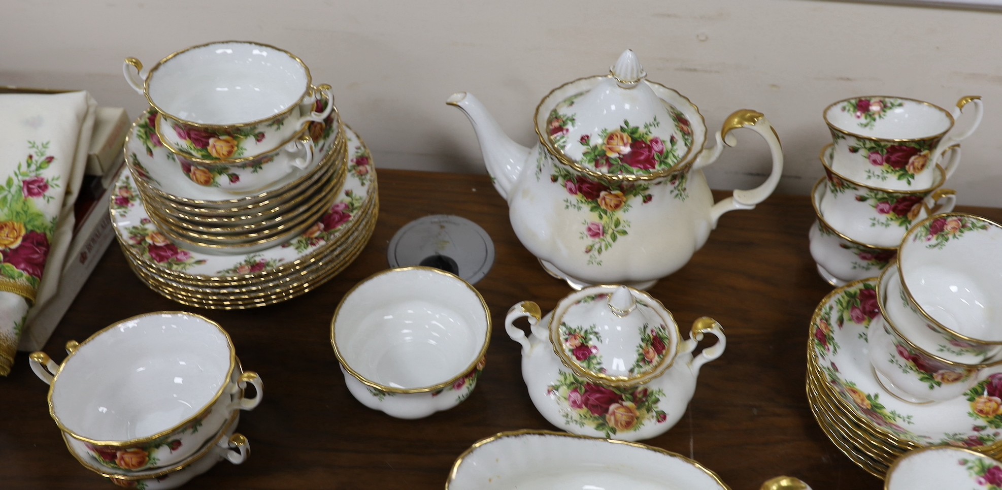 Royal Albert Old Country Rose dinner and tea service, to include a large biscuit box three tier cake stand etc